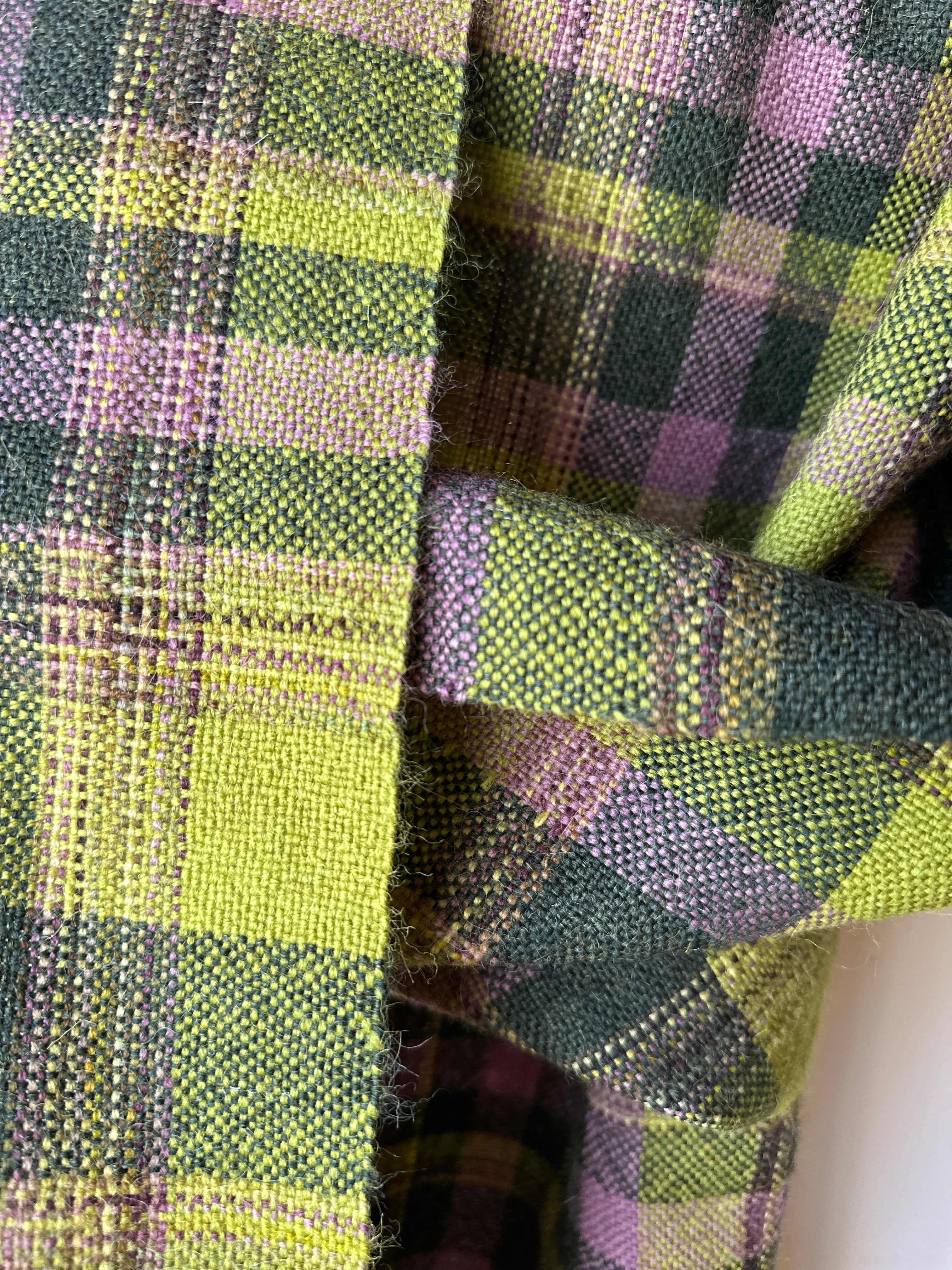 Close-up of green and purple plaid scarf