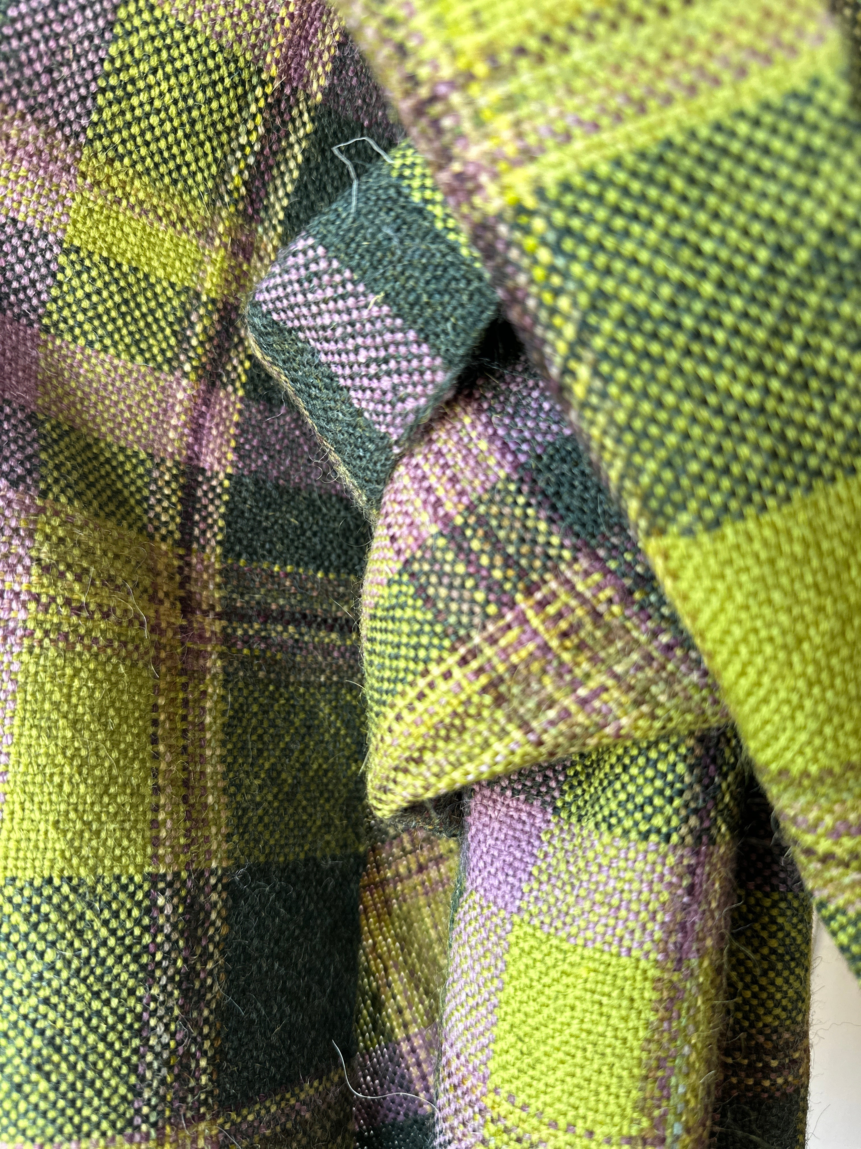 Close-up of green and purple plaid scarf